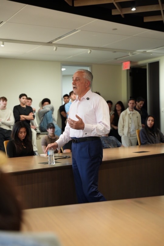 A mentor speaking to the room
